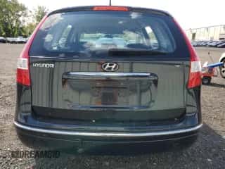 2009 Hyundai Elantra Touring z VIN KMHDC86E99U031713, wystawiony jako Copart lot #70644314 z przebiegiem 95 321 mil mil oraz Szkoda całkowita • Salvage title. Historia ofert i sprzedaży dostępna na DreamBid. Obrazek 6.