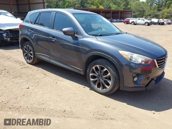 ✅ 2016 Mazda CX-5 Grand Touring • VIN: JM3KE2DYXG0769581 • Lot: 43174558. Listed on IAAI with 206,517 mi. Free auction sales archive from the USA and detailed vehicle history report at DreamBid. Image 1.