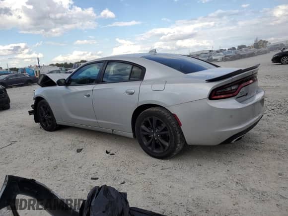 2021 Dodge Charger SXT с VIN 2C3CDXJG2MH577592, выставлен на аукционе Copart как лот 85522315 с пробегом 74 042 миль миль и Списание • Salvage title. История ставок и продаж доступна на DreamBid. Изображение 2.