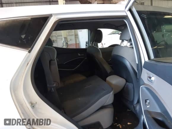 2015 Hyundai Santa Fe z VIN 5XYZTDLB4FG294735, wystawiony jako IAAI lot #43230960 z przebiegiem 169 342 mil mil oraz . Historia ofert i sprzedaży dostępna na DreamBid. Obrazek 8.