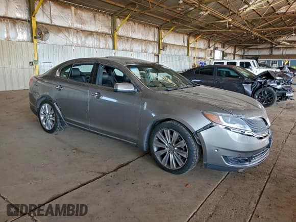 ✅ 2015 Lincoln MKS EcoBoost • VIN: 1LNHL9FT7FG603894 • Лот: 94300245. Опубликован ранее на Copart с пробегом 99 579 миль. Бесплатный доступ к архиву аукционных продаж из США и подробный отчёт об истории автомобиля на DreamBid. Изображение 4.