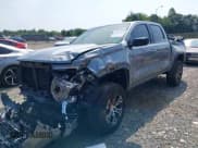 ✅ 2023 GMC Canyon 4WD AT4 • VIN: 1GTP6DEK6P1143991 • Lot: 42865413. Listed on IAAI with 49,712 mi. Free auction sales archive from the USA and detailed vehicle history report at DreamBid. Image 2.