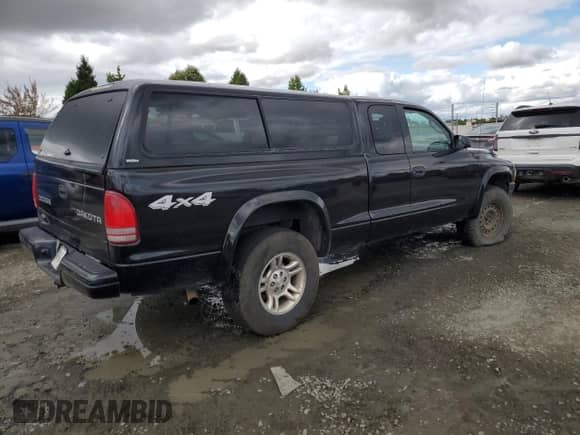 2003 Dodge Dakota Sport z VIN 1D7HG32N43S102313, wystawiony jako Copart lot #70307144 z przebiegiem 139 079 mil mil oraz Szkoda całkowita • Salvage title. Historia ofert i sprzedaży dostępna na DreamBid. Obrazek 3.