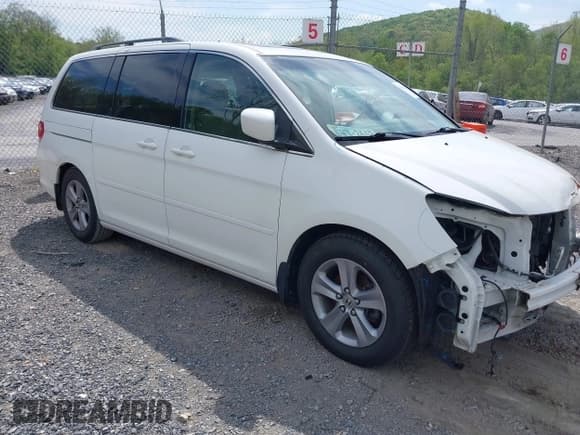 ✅ 2010 Honda Odyssey Touring • VIN: 5FNRL3H90AB039449 • Lot: 42032203. Listed on IAAI with 128,265 mi. Free auction sales archive from the USA and detailed vehicle history report at DreamBid. Image 1.