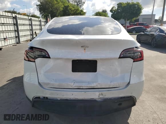✅ 2021 Tesla Model Y Standard Range • VIN: 5YJYGDEDXMF103452 • Lot: 82534615. Listed on Copart with 56,910 mi. Free auction sales archive from the USA and detailed vehicle history report at DreamBid. Image 6.