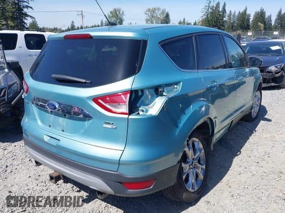 ✅ 2013 Ford Escape SEL • VIN: 1FMCU9H99DUC55653 • Lot: 42002872. Wystawiony na IAAI z przebiegiem 84 776 mil. Bezpłatny archiwum sprzedaży aukcyjnych z USA i szczegółowy raport historii pojazdu na DreamBid. Zdjęcie 4.