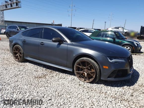 ✅ 2015 Audi RS 7 Prestige • VIN: WUAW2AFC8FN900610 • Лот: 50708225. Опубликован ранее на Copart с пробегом 103 811 миль. Бесплатный доступ к архиву аукционных продаж из США и подробный отчёт об истории автомобиля на DreamBid. Изображение 4.