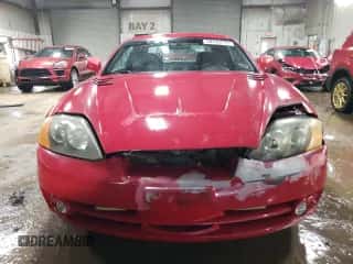 2003 Hyundai Tiburon с VIN KMHHM65D73U018137, выставлен на аукционе Copart как лот 50370215 с пробегом 162 258 миль миль и Списание • Salvage title. История ставок и продаж доступна на DreamBid. Изображение 5.