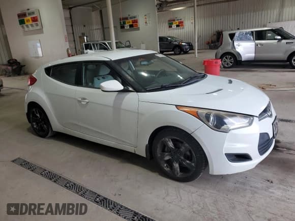 ✅ 2012 Hyundai Veloster w/Red Int • VIN: KMHTC6AD8CU039761 • Lot: 84596195. Listed on Copart with 120,240 mi. Free auction sales archive from the USA and detailed vehicle history report at DreamBid. Image 4.