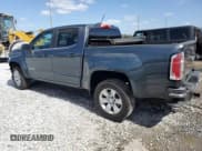 ✅ 2015 GMC Canyon 2WD SLE • VIN: 1GTG5BE34F1173408 • Лот: 55027555. Опубликован ранее на Copart с пробегом 103 222 миль. Бесплатный доступ к архиву аукционных продаж из США и подробный отчёт об истории автомобиля на DreamBid. Изображение 2.