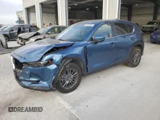 ✅ 2021 Mazda CX-5 Touring • VIN: JM3KFBCM8M1370668 • Lot: 81922665. Wystawiony na Copart z przebiegiem 86 596 mil. Bezpłatny archiwum sprzedaży aukcyjnych z USA i szczegółowy raport historii pojazdu na DreamBid. Zdjęcie 1.