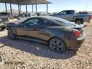 2004 Hyundai Tiburon GS z VIN KMHHM65D44U112560, wystawiony jako Copart lot #50506165 z przebiegiem 251 237 mil mil oraz Czysty tytuł • Clean title. Historia ofert i sprzedaży dostępna na DreamBid. Obrazek 2.