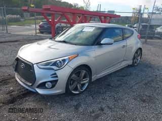 2014 Hyundai Veloster Turbo with VIN KMHTC6AE9EU189356, listed as a IAAI auction lot 43529684 with 96,297 mi miles and . Bid and sale history available at DreamBid. Image 2.