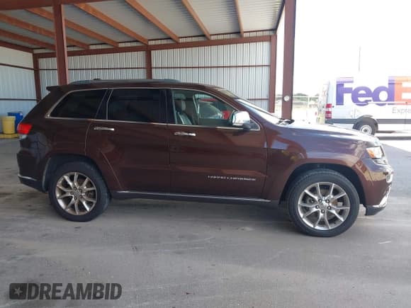 ✅ 2015 Jeep Grand Cherokee Summit • VIN: 1C4RJEJG2FC829205 • Lot: 43469676. Listed on IAAI with 89,893 mi. Free auction sales archive from the USA and detailed vehicle history report at DreamBid. Image 13.