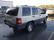✅ 1996 Jeep Grand Cherokee Laredo • VIN: 1J4FX58SXTC298997 • Lot: 43678167. Wystawiony na IAAI z przebiegiem 182 475 mil. Bezpłatny archiwum sprzedaży aukcyjnych z USA i szczegółowy raport historii pojazdu na DreamBid. Zdjęcie 4.