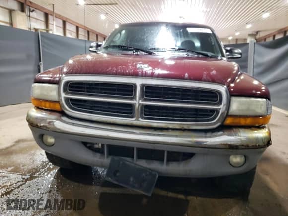 2000 Dodge Dakota Sport z VIN 1B7GG22NXYS573079, wystawiony jako Copart lot #66582204 z przebiegiem 128 435 mil mil oraz Czysty tytuł • Clean title. Historia ofert i sprzedaży dostępna na DreamBid. Obrazek 5.