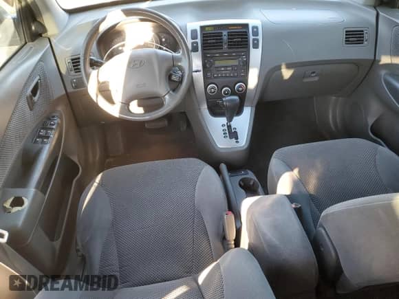 2006 Hyundai Tucson GLS z VIN KM8JN12D16U345952, wystawiony jako Copart lot #82710294 z przebiegiem 138 257 mil mil oraz Szkoda całkowita • Salvage title. Historia ofert i sprzedaży dostępna na DreamBid. Obrazek 8.