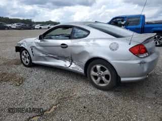 2005 Hyundai Tiburon GS с VIN KMHHM65D35U182780, выставлен на аукционе Copart как лот 58958295 с пробегом 186 652 миль миль и Чистый • Clean title. История ставок и продаж доступна на DreamBid. Изображение 2.