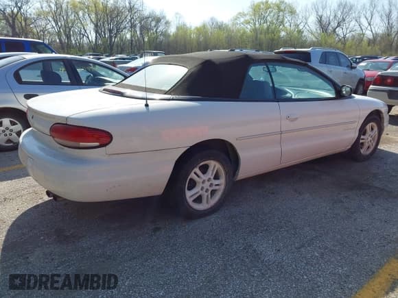 ✅ 1997 Chrysler Sebring JXi • VIN: 3C3EL55H2VT624986 • Lot: 41957974. Listed on IAAI with 132,305 mi. Free auction sales archive from the USA and detailed vehicle history report at DreamBid. Image 4.