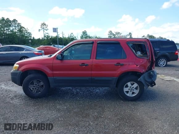 ✅ 2006 Ford Escape XLS • VIN: 1FMYU02ZX6KC27594 • Lot: 41162362. Listed on IAAI with 73,444 mi. Free auction sales archive from the USA and detailed vehicle history report at DreamBid. Image 13.
