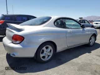 2001 Hyundai Tiburon с VIN KMHJG25F11U258137, выставлен на аукционе Copart как лот 63812855 с пробегом 27 682 миль миль и Чистый • Clean title. История ставок и продаж доступна на DreamBid. Изображение 3.