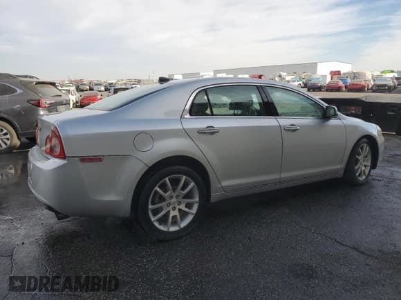 ✅ 2012 Chevrolet Malibu LTZ • VIN: 1G1ZG5E7XCF128343 • Lot: 74536074. Listed on Copart with 132,162 mi. Free auction sales archive from the USA and detailed vehicle history report at DreamBid. Image 3.
