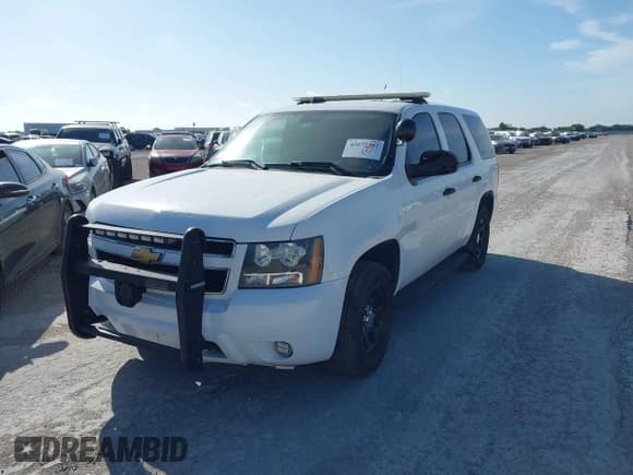 ✅ 2014 Chevrolet Tahoe Commercial • VIN: 1GNLC2E06ER193189 • Lot: 42672382. Listed on IAAI with 78,402 mi. Free auction sales archive from the USA and detailed vehicle history report at DreamBid. Image 2.
