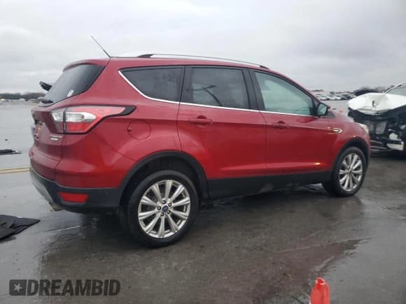 ✅ 2017 Ford Escape Titanium • VIN: 1FMCU0J92HUD38613 • Lot: 94042855. Listed on Copart with 112,995 mi. Free auction sales archive from the USA and detailed vehicle history report at DreamBid. Image 3.