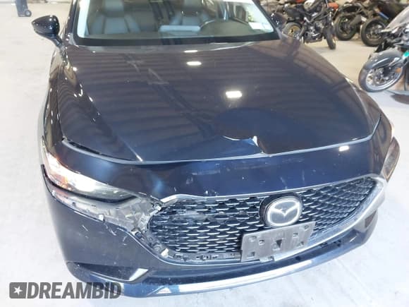 ✅ 2021 Mazda 3 Preferred • VIN: JM1BPBCL7M1334712 • Lot: 43160500. Listed on IAAI with 57,546 mi. Free auction sales archive from the USA and detailed vehicle history report at DreamBid. Image 6.
