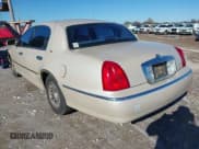 ✅ 1999 Lincoln Town Car Cartier • VIN: 1LNHM83W1XY641381 • Lot: 43789046. Listed on IAAI with Not provided. Free auction sales archive from the USA and detailed vehicle history report at DreamBid. Image 3.