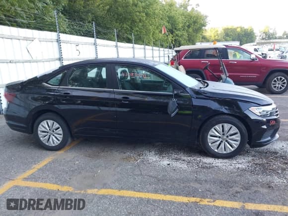 ✅ 2019 Volkswagen Jetta S • VIN: 3VWN57BU9KM099995 • Lot: 43085470. Wystawiony na IAAI z przebiegiem 75 775 mil. Bezpłatny archiwum sprzedaży aukcyjnych z USA i szczegółowy raport historii pojazdu na DreamBid. Zdjęcie 13.