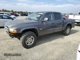2002 Dodge Dakota SLT z VIN 1B7HG48N82S639319, wystawiony jako Copart lot #89595265 z przebiegiem Nie podano mil oraz Czysty tytuł • Clean title. Historia ofert i sprzedaży dostępna na DreamBid. Obrazek 1.