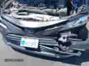 2022 Toyota Camry Hybrid XLE with VIN 4T1F31AK4NU571560, listed as a IAAI auction lot 42654973 with 10,810 mi miles and . Bid and sale history available at DreamBid. Image 6.