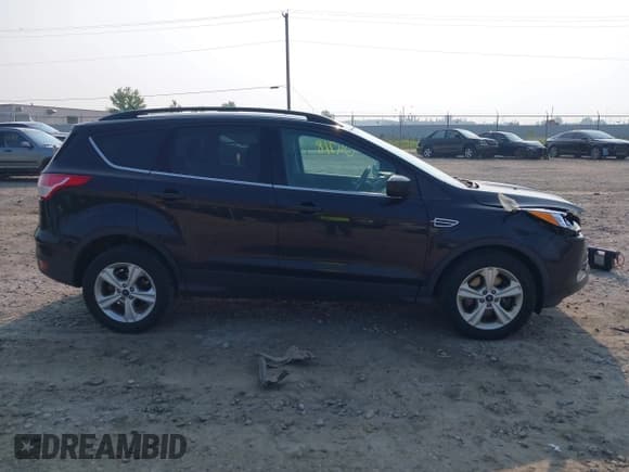✅ 2015 Ford Escape SE • VIN: 1FMCU9GX0FUC75583 • Lot: 42904718. Listed on IAAI with 169,482 mi. Free auction sales archive from the USA and detailed vehicle history report at DreamBid. Image 13.