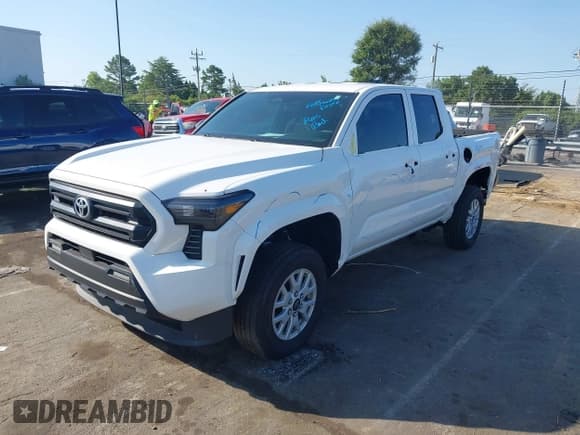 ✅ 2024 Toyota Tacoma SR • VIN: 3TYKD5HN2RT011879 • Lot: 42789609. Listed on IAAI with 9,169 mi. Free auction sales archive from the USA and detailed vehicle history report at DreamBid. Image 2.