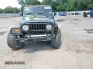 2005 Jeep Wrangler X с VIN 1J4FA39S45P319326, выставлен на аукционе Copart как лот 64983495 с пробегом 156 551 миль миль и Списание • Salvage title. История ставок и продаж доступна на DreamBid. Изображение 14.