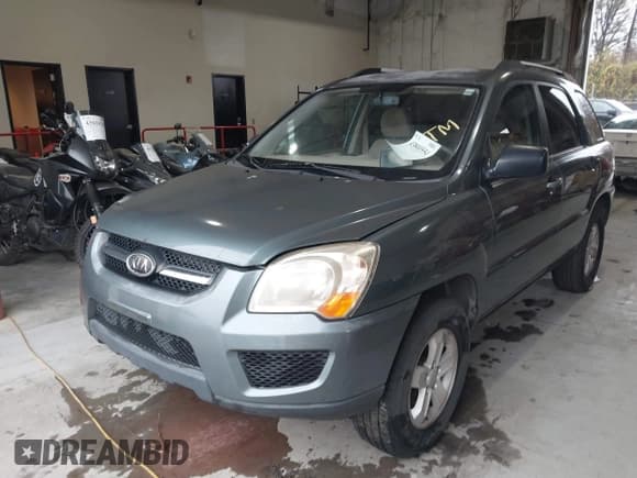 ✅ 2009 Kia Sportage EX • VIN: KNDJF723397563597 • Лот: 43800554. Опубликован ранее на IAAI с пробегом 196 423 миль. Бесплатный доступ к архиву аукционных продаж из США и подробный отчёт об истории автомобиля на DreamBid. Изображение 2.