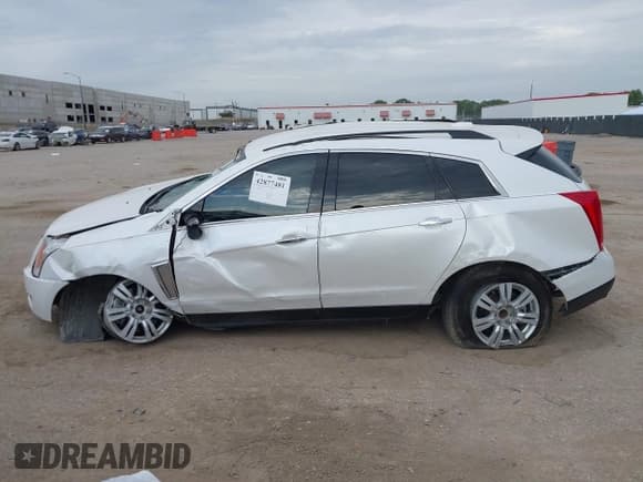 ✅ 2015 Cadillac SRX • VIN: 3GYFNAE36FS527220 • Lot: 42877481. Listed on IAAI with 209,815 mi. Free auction sales archive from the USA and detailed vehicle history report at DreamBid. Image 14.