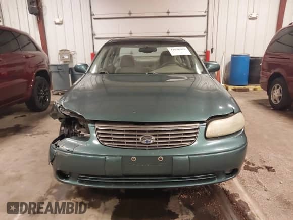 1998 Chevrolet Malibu LS z VIN 1G1NE52M6W6104642, wystawiony jako IAAI lot #41636923 z przebiegiem 116 944 mil mil oraz . Historia ofert i sprzedaży dostępna na DreamBid. Obrazek 13.