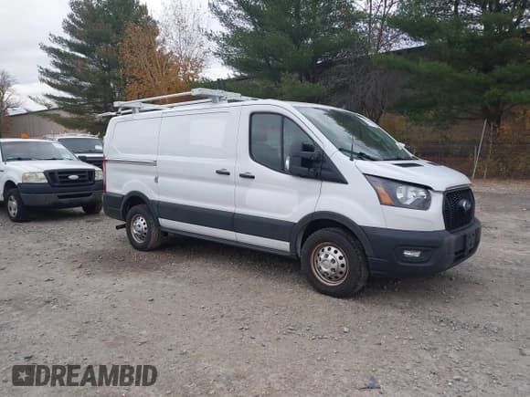 ✅ 2023 Ford Transit Cargo • VIN: 1FTBR2Y87PKA30017 • Lot: 43521186. Listed on IAAI with 53,466 mi. Free auction sales archive from the USA and detailed vehicle history report at DreamBid. Image 1.