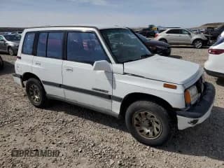 ✅ 1995 Suzuki Sidekick • VIN: JS3TD03V4S4113472 • Lot: 51279074. Listed on Copart with 199,736 mi. Free auction sales archive from the USA and detailed vehicle history report at DreamBid. Image 4.