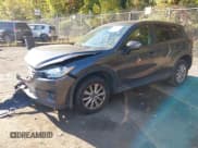 ✅ 2016 Mazda CX-5 Touring • VIN: JM3KE4CY5G0716056 • Lot: 43521281. Listed on IAAI with 107,968 mi. Free auction sales archive from the USA and detailed vehicle history report at DreamBid. Image 2.