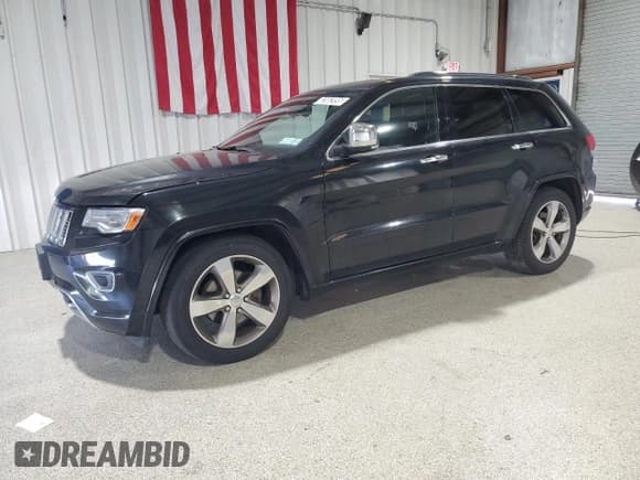 ✅ 2014 Jeep Grand Cherokee Overland • VIN: 1C4RJFCG5EC467601 • Lot: 82082095. Listed on Copart with 127,001 mi. Free auction sales archive from the USA and detailed vehicle history report at DreamBid. Image 1.