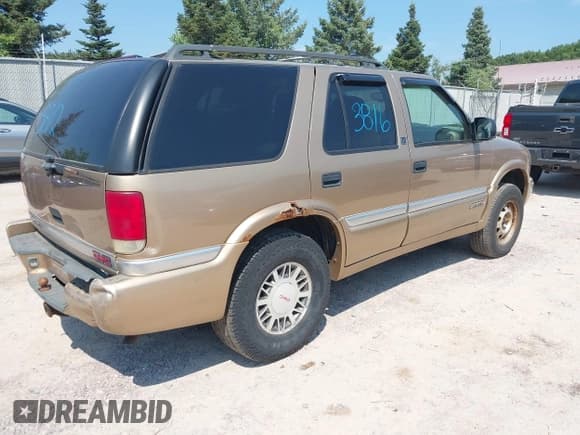 ✅ 1999 GMC Jimmy SLT • VIN: 1GKDT13W7X2545842 • Lot: 42973812. Wystawiony na IAAI z przebiegiem 236 268 mil. Bezpłatny archiwum sprzedaży aukcyjnych z USA i szczegółowy raport historii pojazdu na DreamBid. Zdjęcie 4.