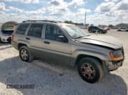 ✅ 2000 Jeep Grand Cherokee Laredo • VIN: 1J4G248S6YC206157 • Lot: 85132095. Listed on Copart with Not provided. Free auction sales archive from the USA and detailed vehicle history report at DreamBid. Image 4.