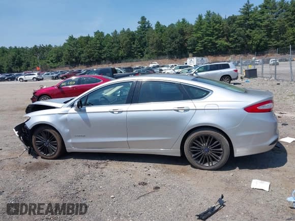 ✅ 2013 Ford Fusion SE Hybrid • VIN: 3FA6P0LU5DR336582 • Lot: 42833472. Listed on IAAI with 149,824 mi. Free auction sales archive from the USA and detailed vehicle history report at DreamBid. Image 14.