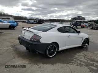 2003 Hyundai Tiburon z VIN KMHHM65D53U042971, wystawiony jako Copart lot #86919434 z przebiegiem 202 250 mil mil oraz Szkoda całkowita • Salvage title. Historia ofert i sprzedaży dostępna na DreamBid. Obrazek 3.