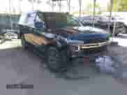 2022 Chevrolet Tahoe Z71 z VIN 1GNSKPKD1NR242429, wystawiony jako IAAI lot #42058520 z przebiegiem 63 699 mil mil oraz . Historia ofert i sprzedaży dostępna na DreamBid. Obrazek 1.