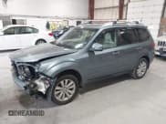✅ 2012 Subaru Forester X Touring • VIN: JF2SHAHC1CH406270 • Lot: 42166953. Listed on IAAI with 144,843 mi. Free auction sales archive from the USA and detailed vehicle history report at DreamBid. Image 2.