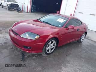 2006 Hyundai Tiburon GT z VIN KMHHN65FX6U229156, wystawiony jako IAAI lot #42082179 z przebiegiem 172 207 mil mil oraz . Historia ofert i sprzedaży dostępna na DreamBid. Obrazek 2.